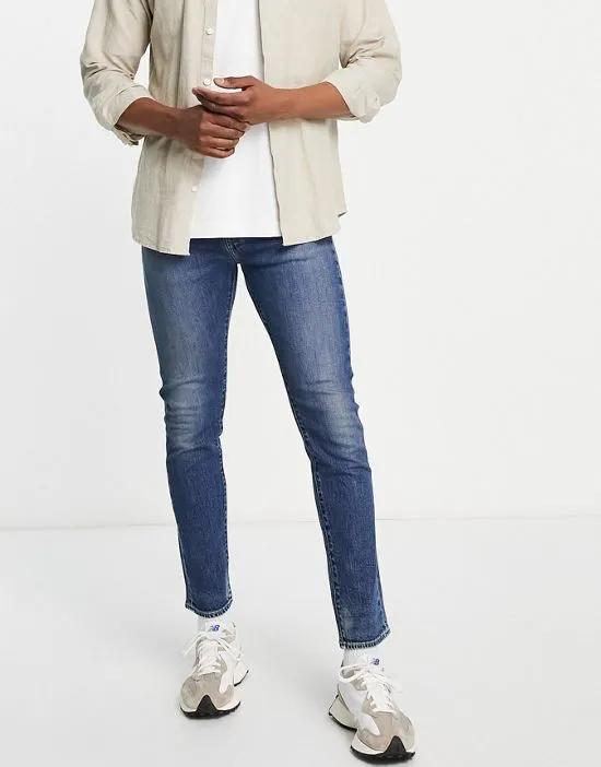 510 skinny jeans in mid wash blue