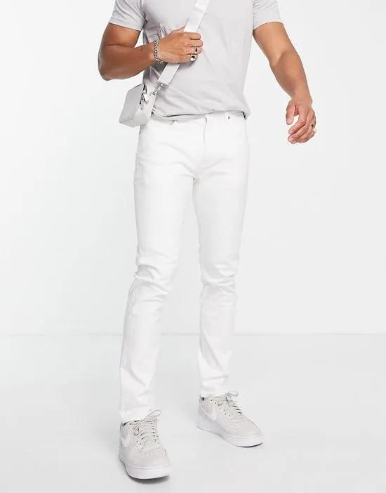 512 slim taper jeans in white