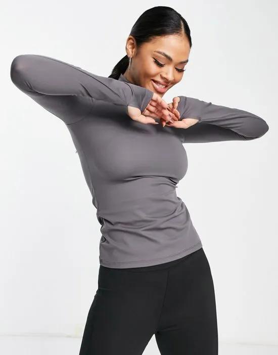active roll neck long sleeve top with thumb hole in charcoal