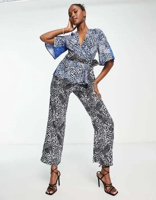 animal print jumpsuit with waist tie in blue