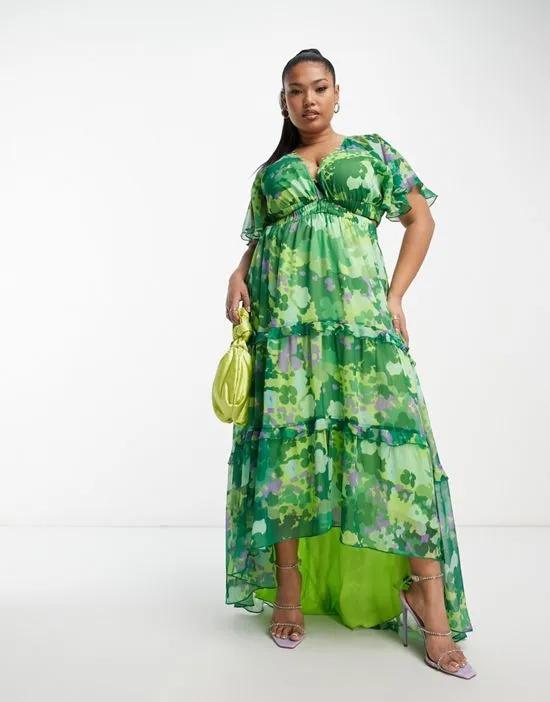 ASOS DESIGN Curve angel sleeve plunge tiered maxi dress with cut out in green blurred floral print