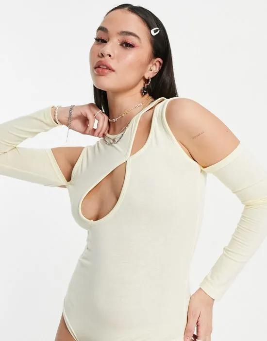 asymmetric cut out bodysuit with sleeve detail in cream