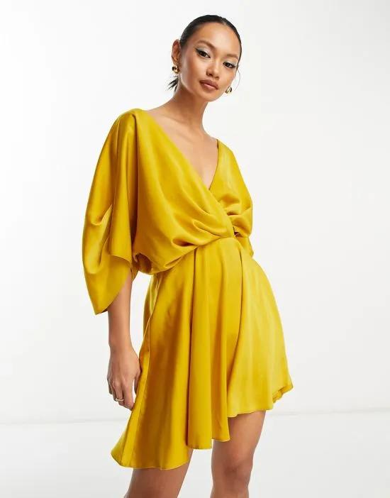 batwing sleeve plunge mini dress in gold