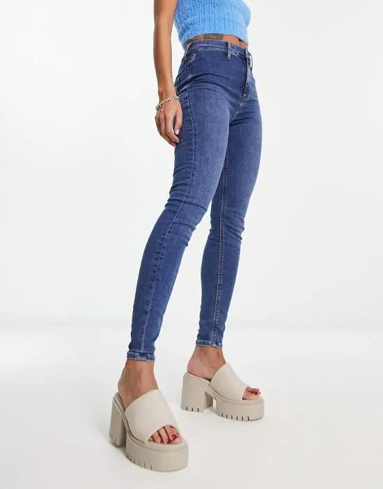 Bershka split hem flare in mid blue