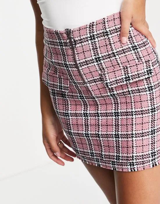 boucle mini skirt with raw hem and pocket detail in pink check print