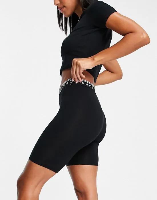 branded elastic legging short in black