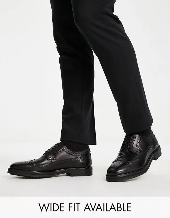 brogue shoes in black leather with chunky sole