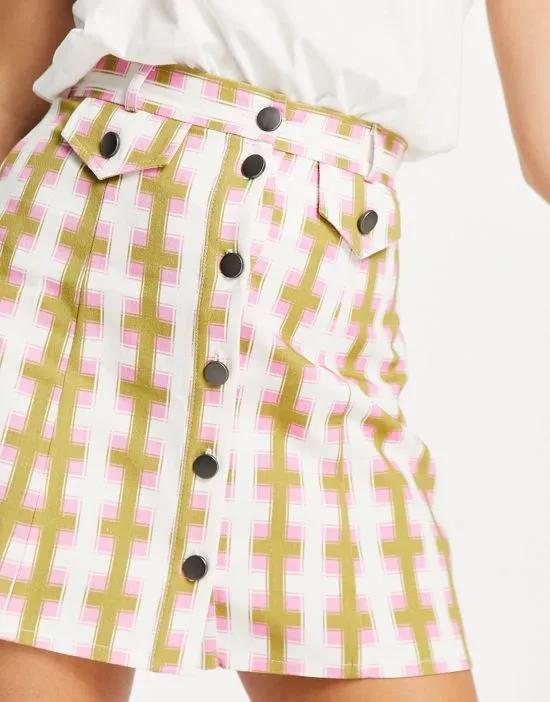 button through mini skirt in geo print