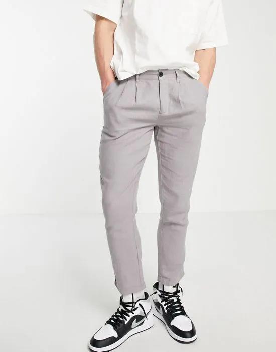 cigarette pants with pleats in gray linen