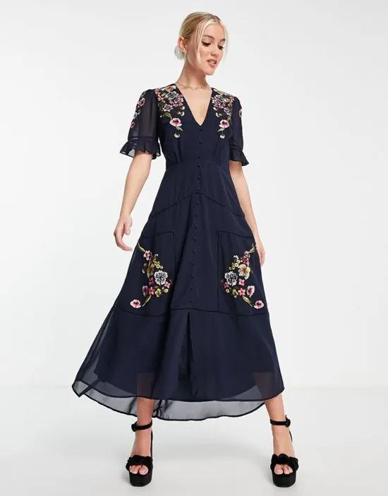 Claudine embroidered dress in navy