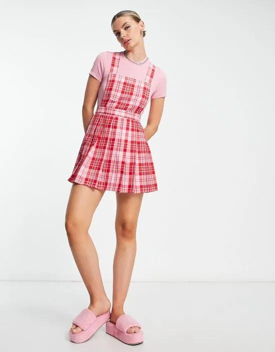 COLLUSION pleated pinafore dress in pink and red check
