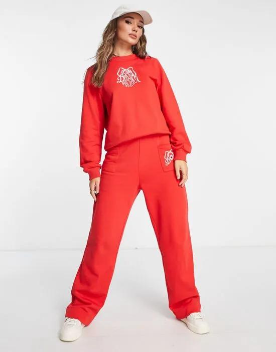 cotton bow embroidered sweatpants in red - part of a set