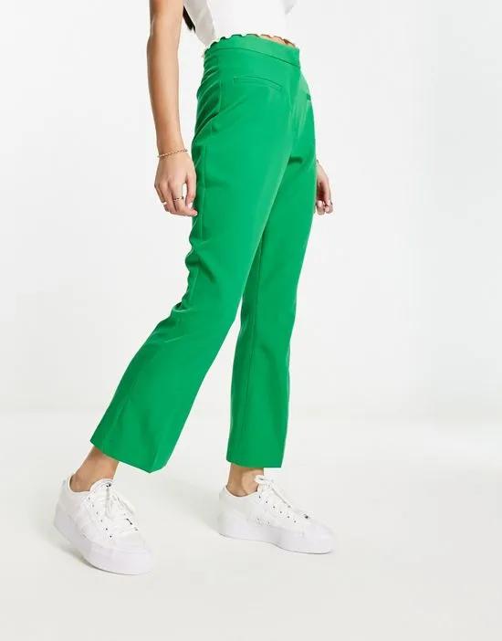 cropped flare pants in green
