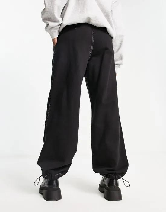denim parachute pants with contrast stitch in black