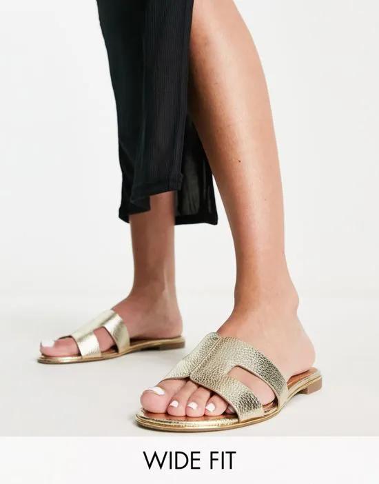 Dune London Wide Fit loopy slip-on flat sandals in gold