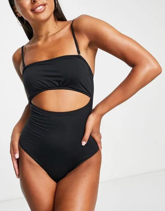 Exclusive ruched bandeau cut out swimsuit in black