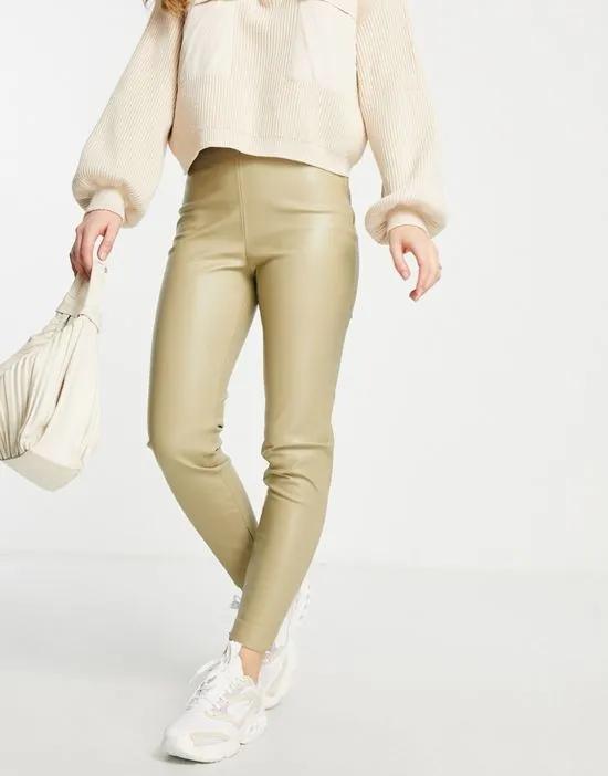 faux leather pants with side slit in light green