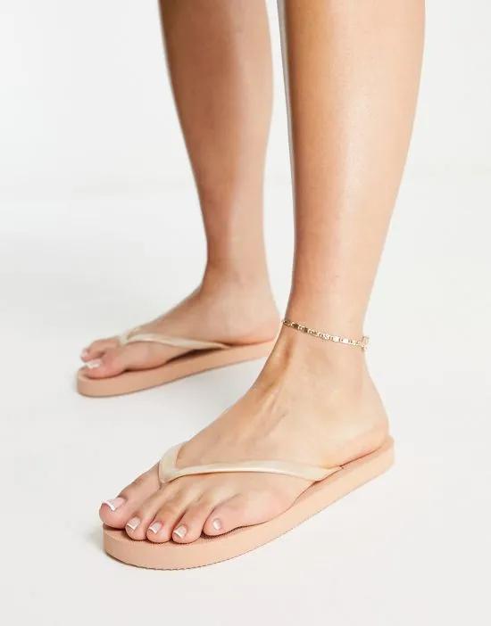 Filter flip flops in cream