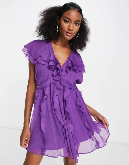 flutter sleeve mini dress with ruffle shoulder and skirt detail in purple