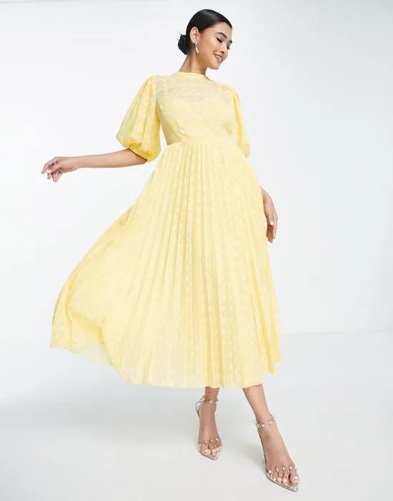 high neck pleated chevron textured midi dress with puff sleeves in yellow