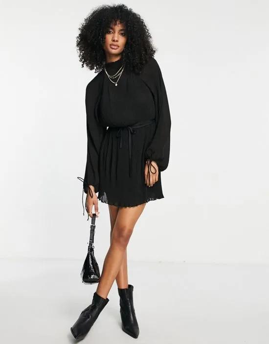 high neck plisse mini dress with blouson sleeve and tie detail