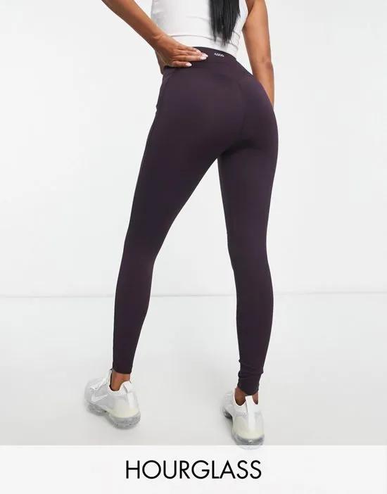 Hourglass icon leggings with booty-sculpting seam detail and pocket