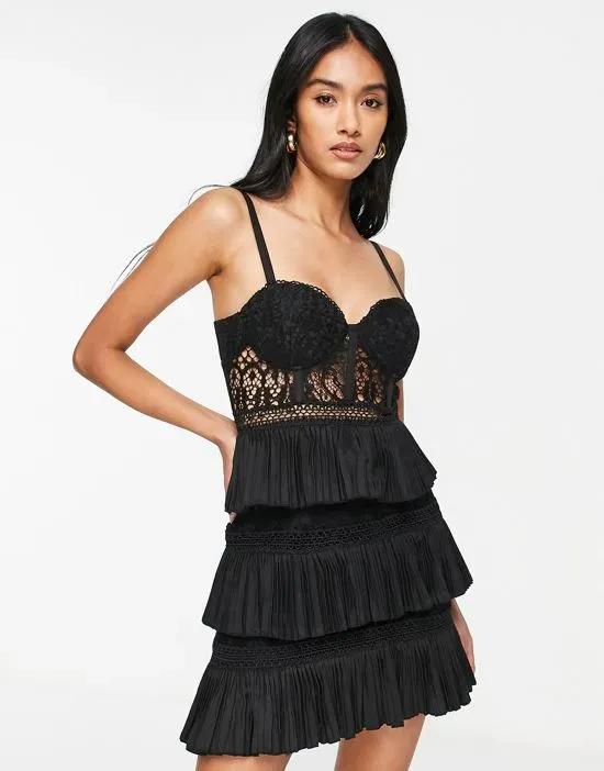 lace corset mini dress with tiered pleated skirt in black