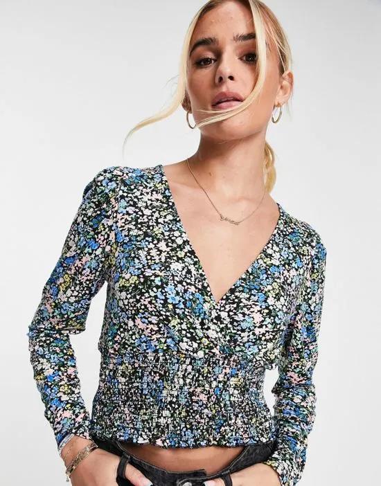 long sleeve shirred top in blue floral