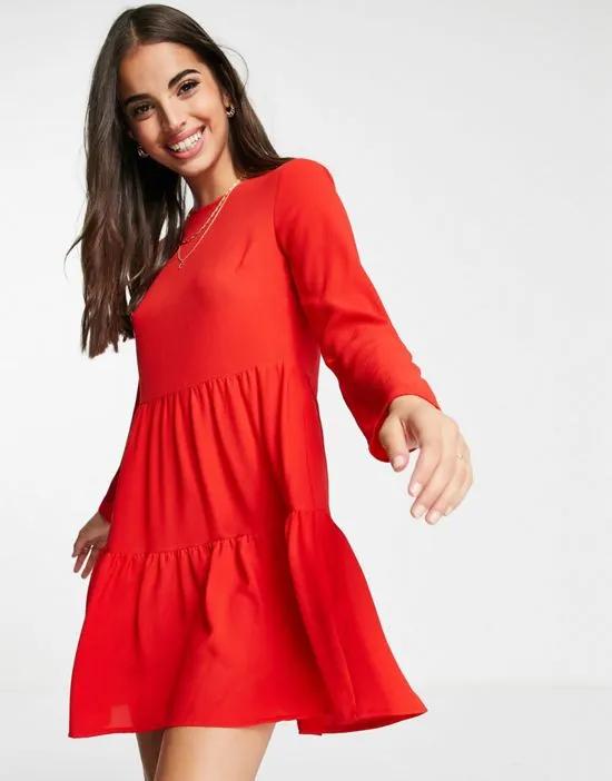 long sleeve tiered smock mini dress in red