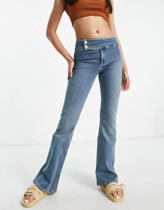 low rise stretch flare jean with waistband detail