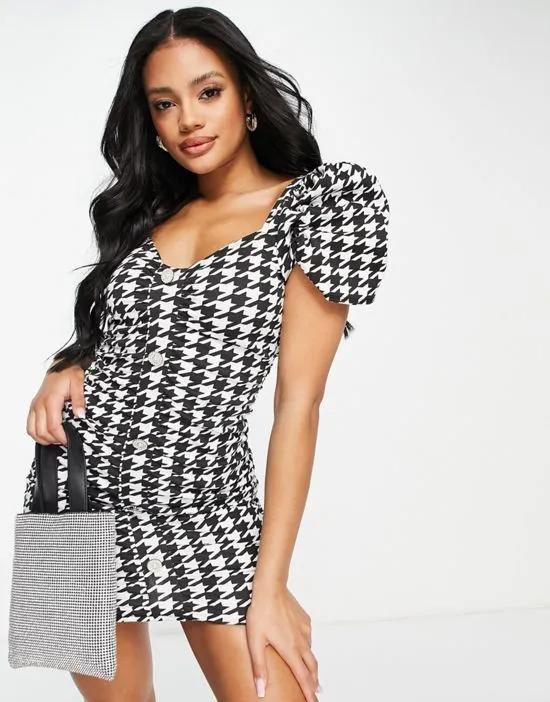 mini dress in houndstooth print with diamante buttons