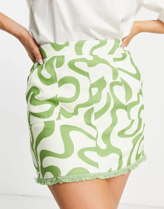 mini skirt with fringe detail in green