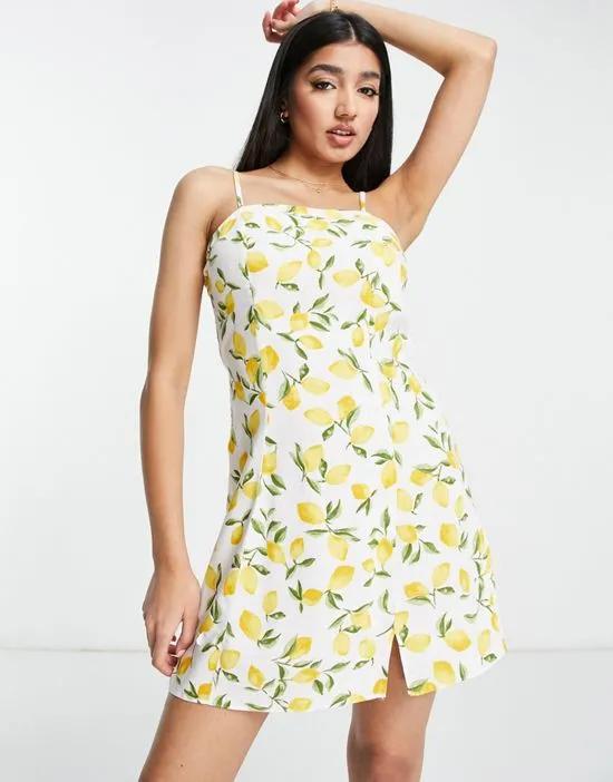 mini slip dress with side slit in white lemon print