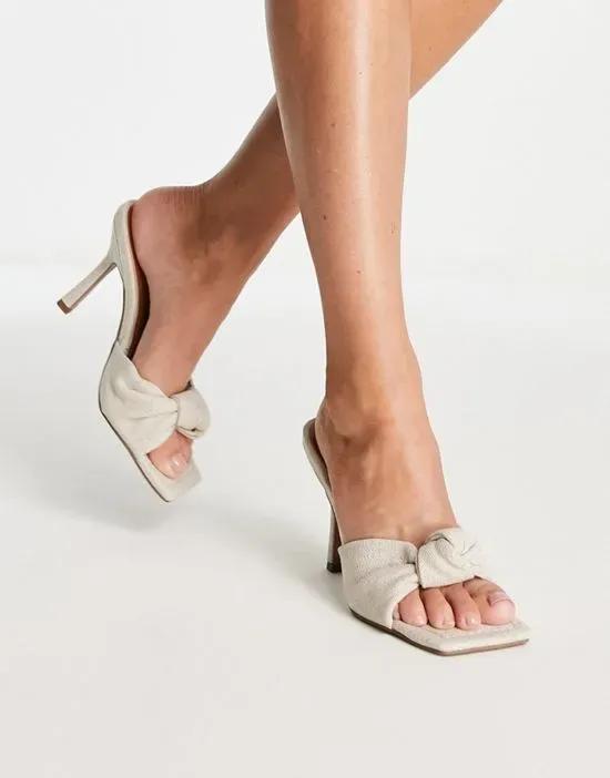Nadina knotted high heeled mules in natural fabrication