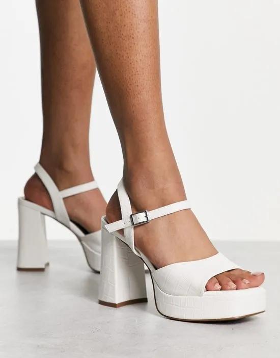 Nurture platform heeled sandals in white croc