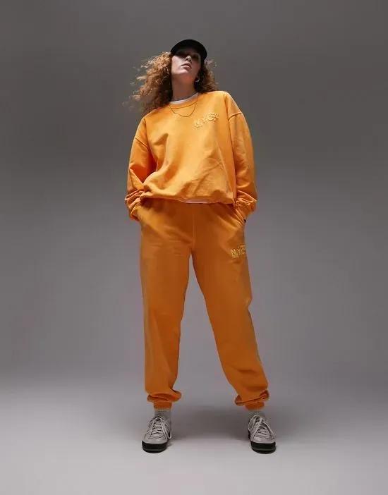 NYC Project puff printed vintage wash oversized sweatpants in orange - part of a set