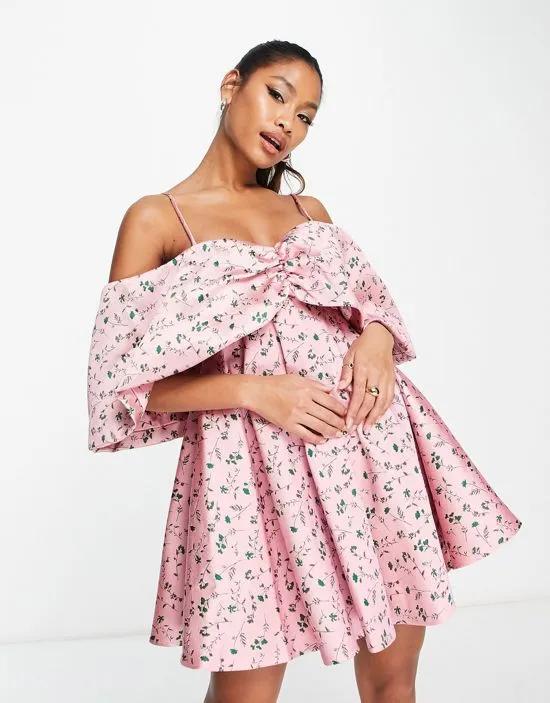 off shoulder drape sleeve textured mini dress in pink floral jacquard