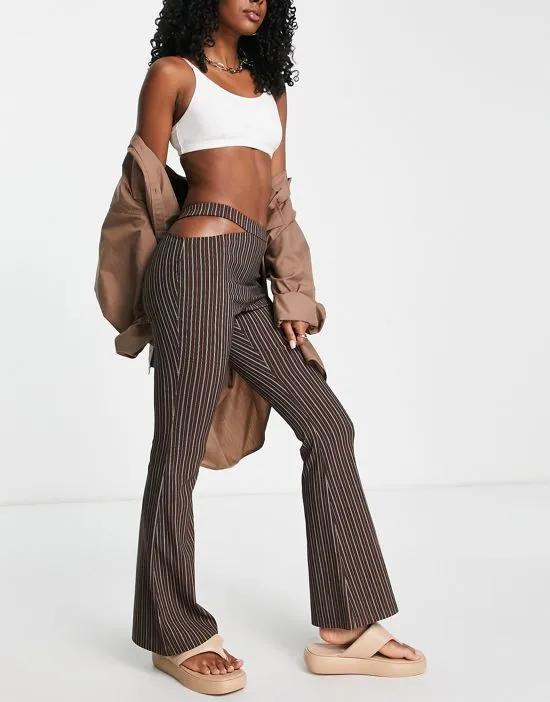 one side cut out bengaline flared pants in brown pinstripe