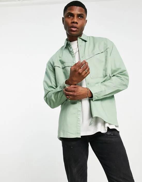 overshirt with angled pocket in sage green