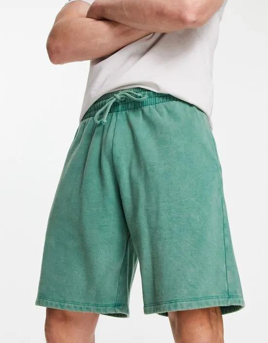 oversized shorts in green acid wash
