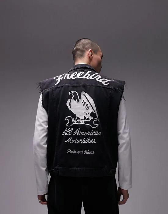 oversized sleeveless denim jacket with free bird back embroidery in black