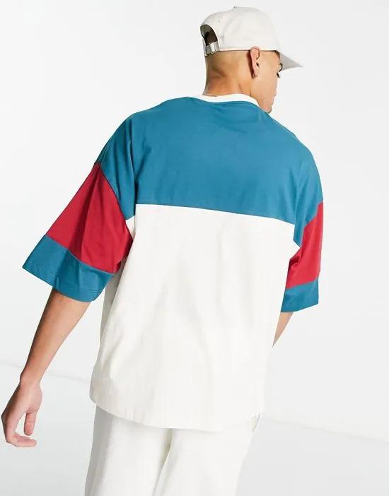 oversized t-shirt in blue and ecru color block with Oakland city print