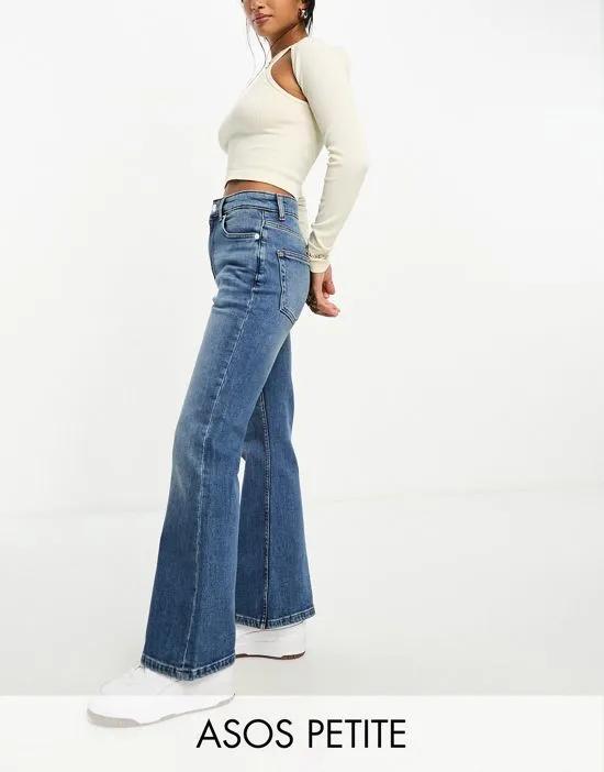 Petite flared jeans in mid blue