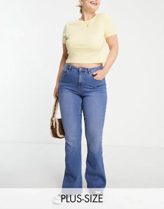 Pieces Curve Peggy high waisted flared jeans in mid wash blue