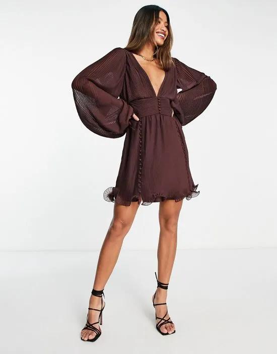 pleat mini dress with button detail and frill hem in burgundy