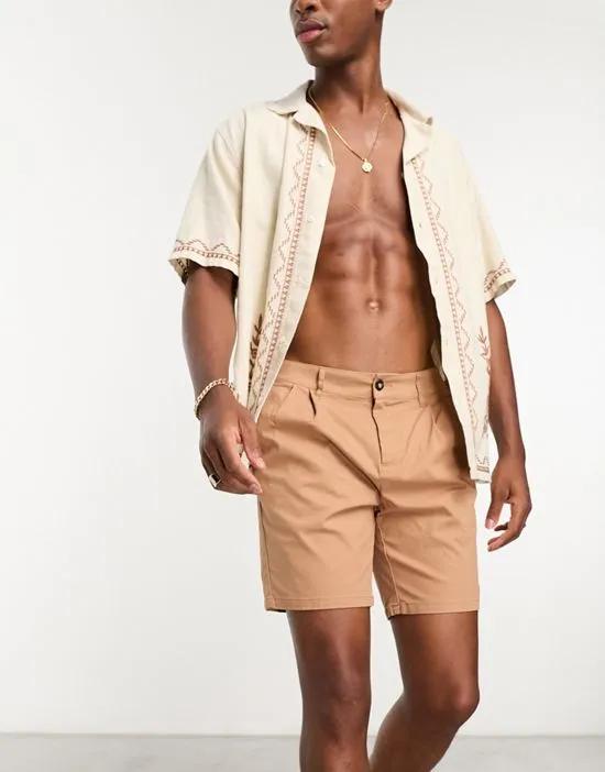 pleated shorts in tan