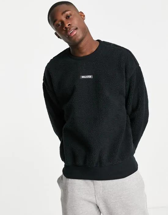 poler fleece sweatshirt in black with chest logo