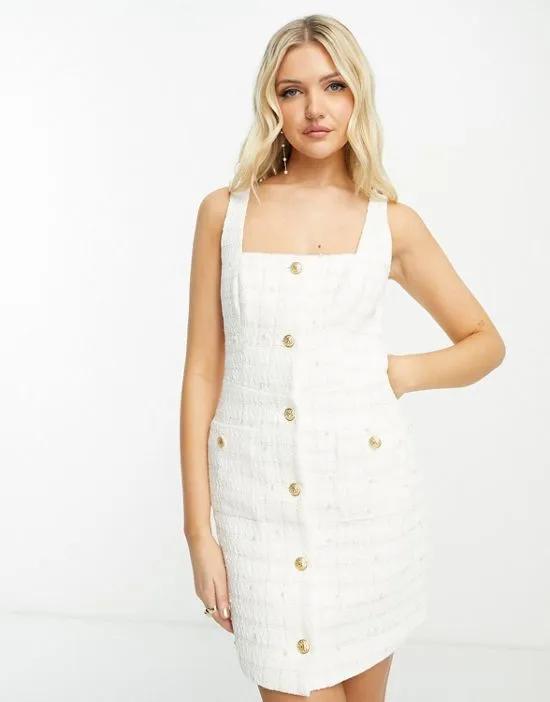 premium boucle pinny dress with pearl details in white