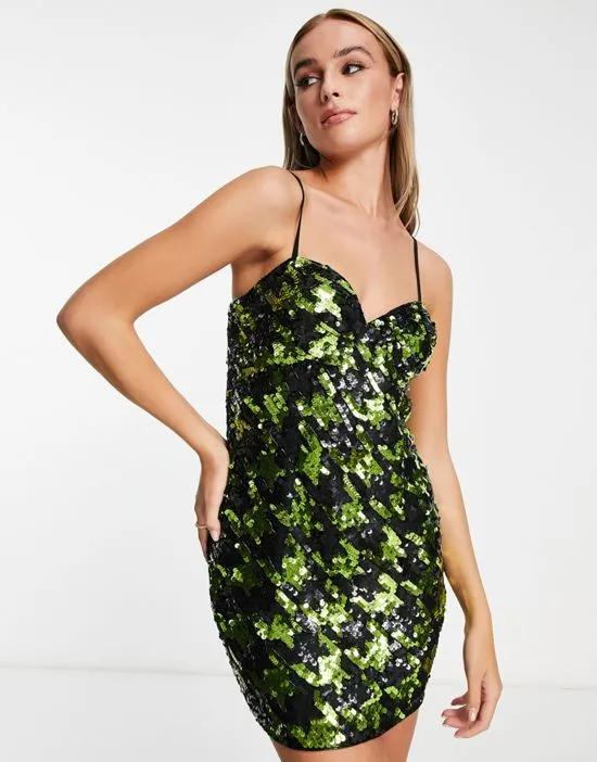 Premium festival sequin dogtooth mini dress in black and green