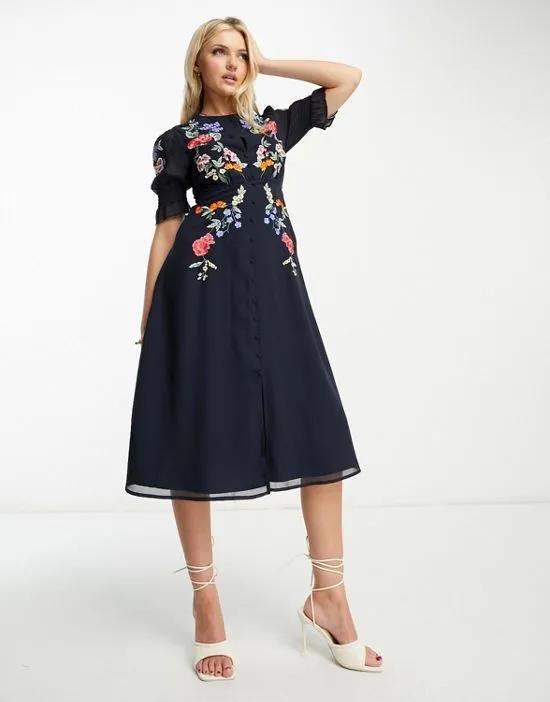puff sleeve embroidered midi dress in navy floral